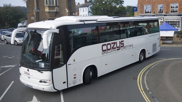 White Cozys executive coach photographed from the front and side