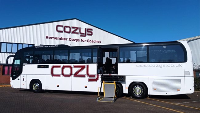 Cozys 80-seat school coach with its wheelchair lift lowered (CO12 ZYO and CO14 ZYO)